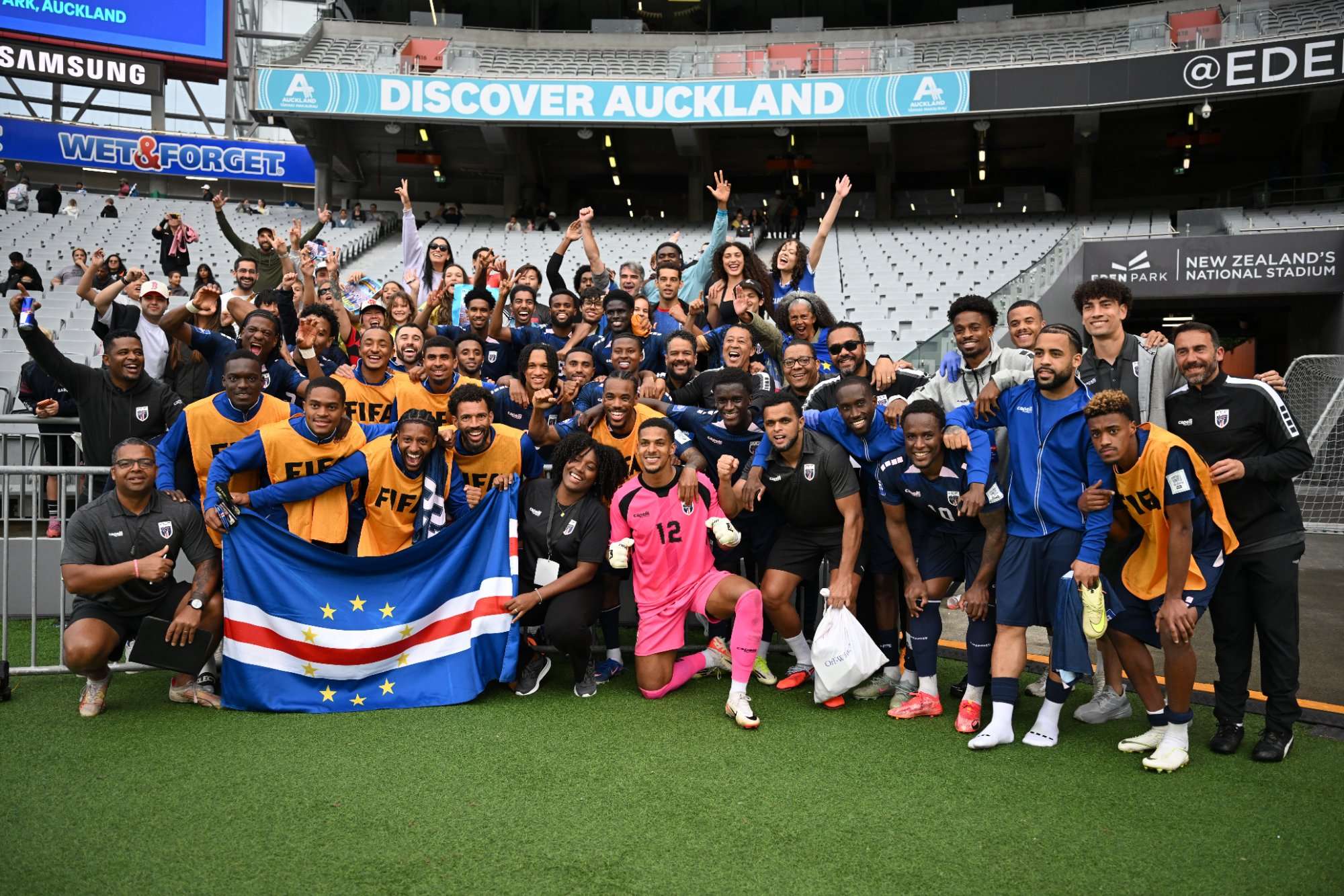 Cabo Verde football team celebrating with national flag at Eden Park Auckland FIFA Series