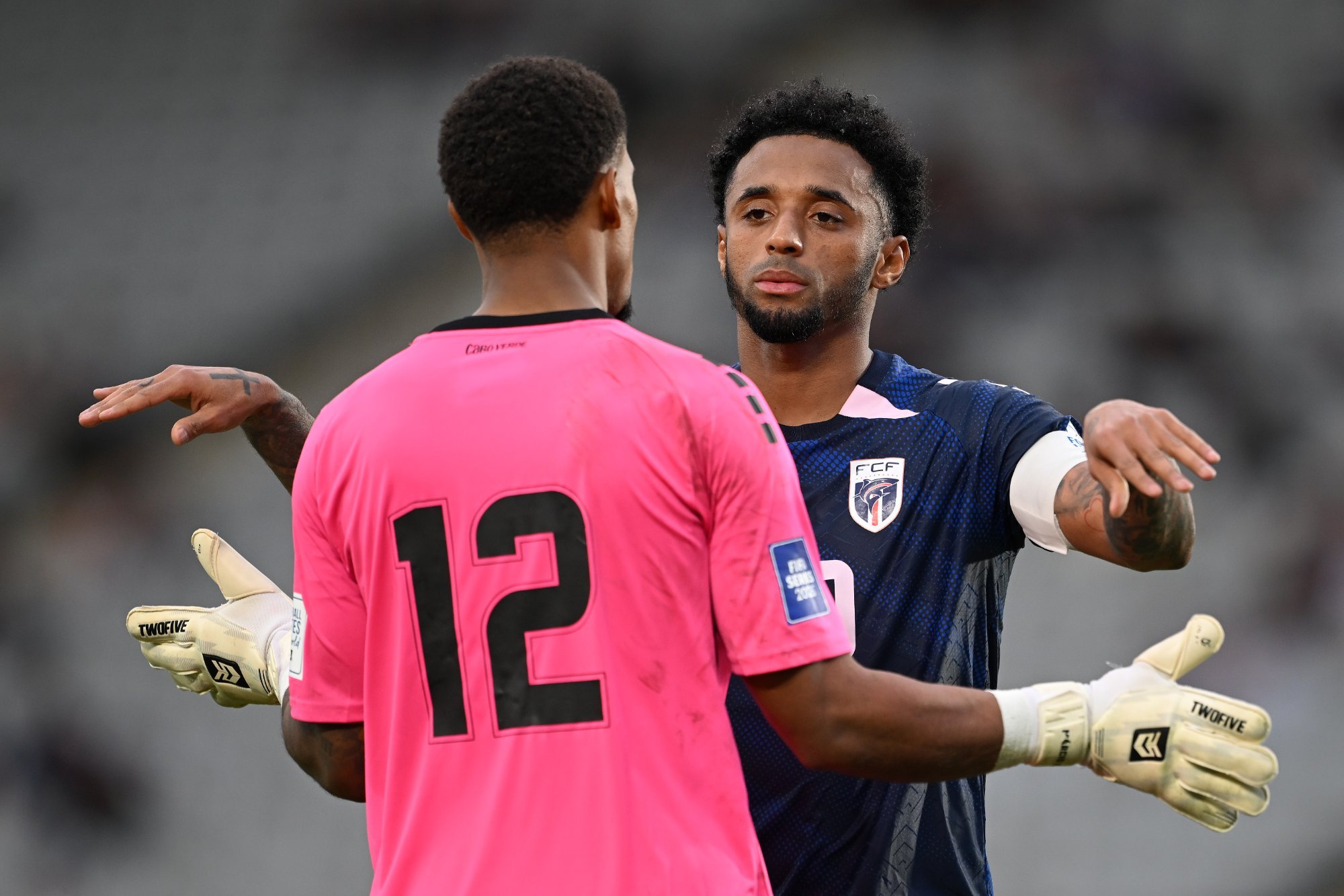Cabo Verde goalkeeper number 12 and teammate embrace during FIFA Series match